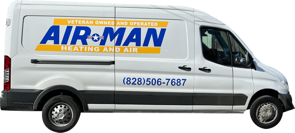 Side of an Air-Man Heating and Air van showing the company phone number