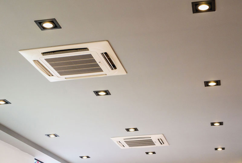 Ceiling-mounted cassette unit installed in a white ceiling